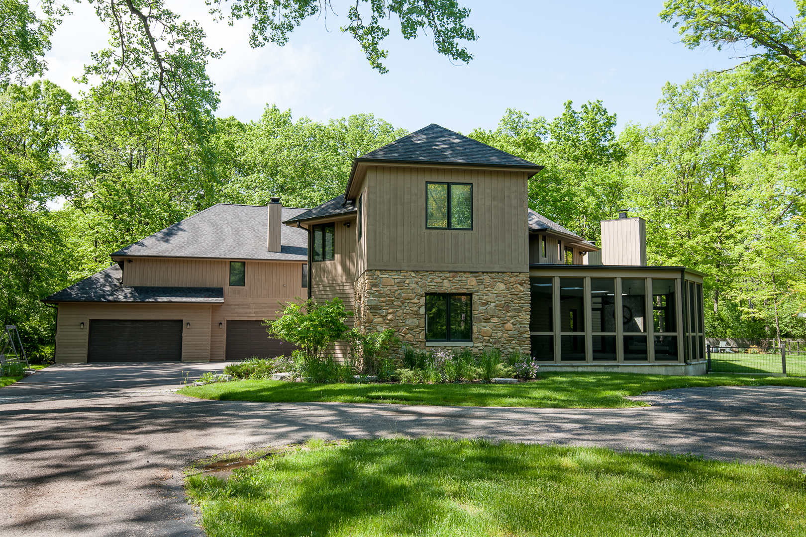 Undisclosed Address Riverwoods, IL 60015 - Photo 2 of 33 a front view of a house with a garden and plants