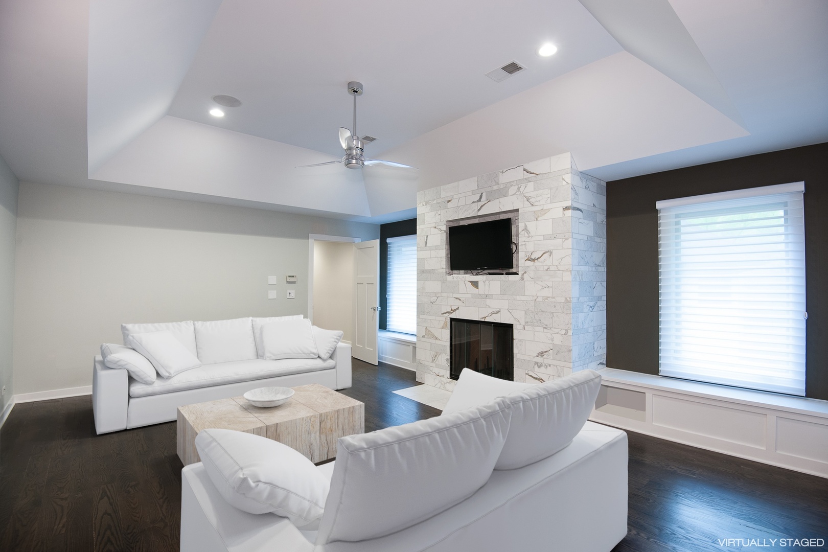 Undisclosed Address Riverwoods, IL 60015 - Photo 28 of 33 a living room with furniture a fireplace and a flat screen tv