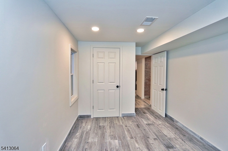 75 Nolans Point Road Lake Hopatcong, NJ 07849 - Photo 14 of 48 a view of an empty room and wooden floor