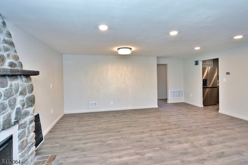 75 Nolans Point Road Lake Hopatcong, NJ 07849 - Photo 15 of 48 a view of an empty room with wooden floor and a window