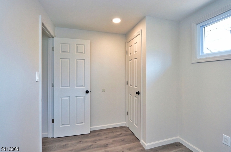 75 Nolans Point Road Lake Hopatcong, NJ 07849 - Photo 16 of 48 a view of a hallway with wooden floor
