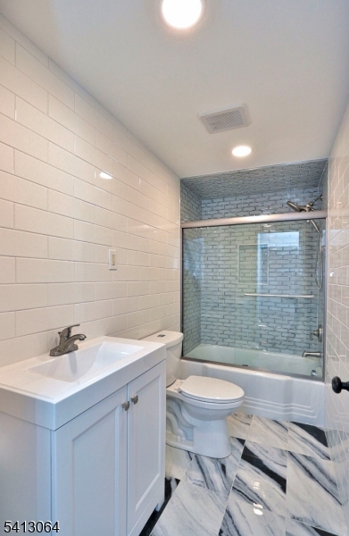 75 Nolans Point Road Lake Hopatcong, NJ 07849 - Photo 18 of 48 a bathroom with a sink a toilet and shower