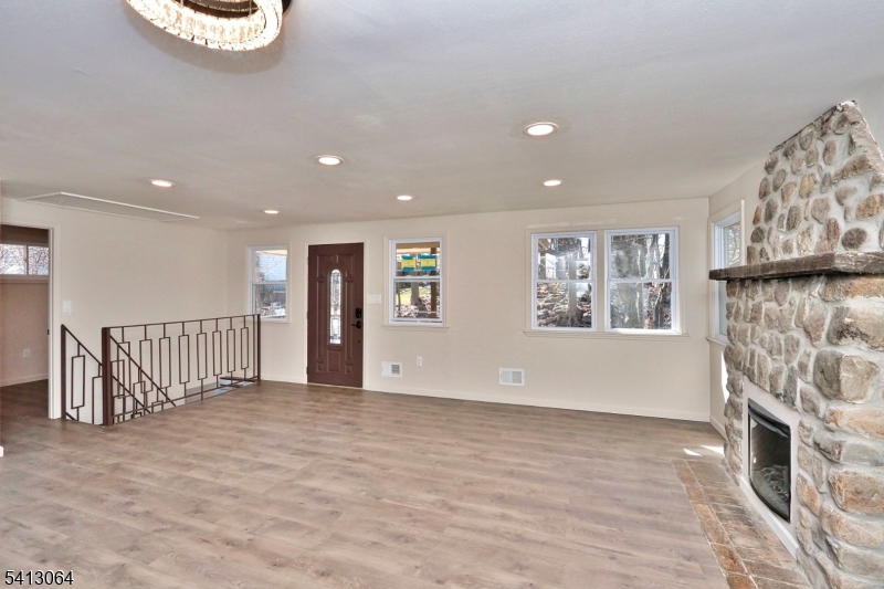 75 Nolans Point Road Lake Hopatcong, NJ 07849 - Photo 2 of 48 a view of an empty room with a fireplace and a window