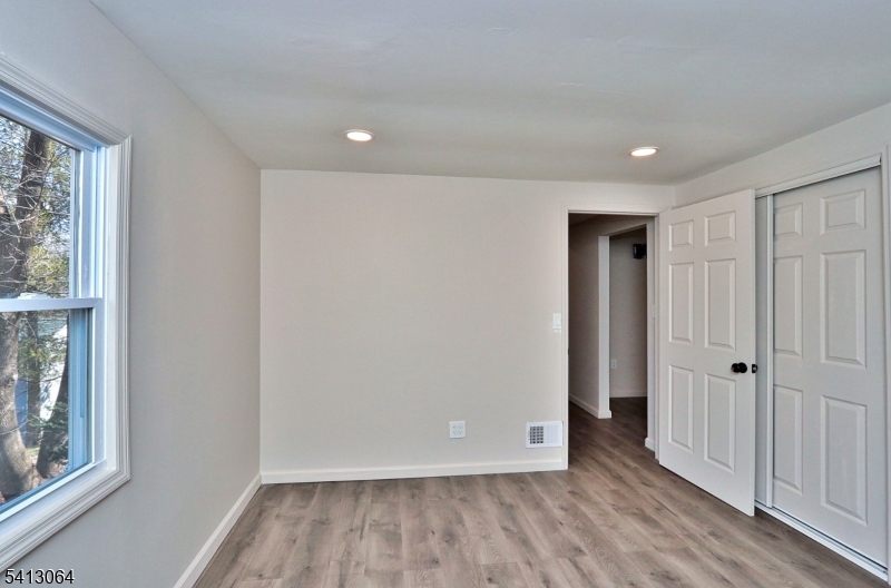 75 Nolans Point Road Lake Hopatcong, NJ 07849 - Photo 24 of 48 a view of wooden floor and windows in a room