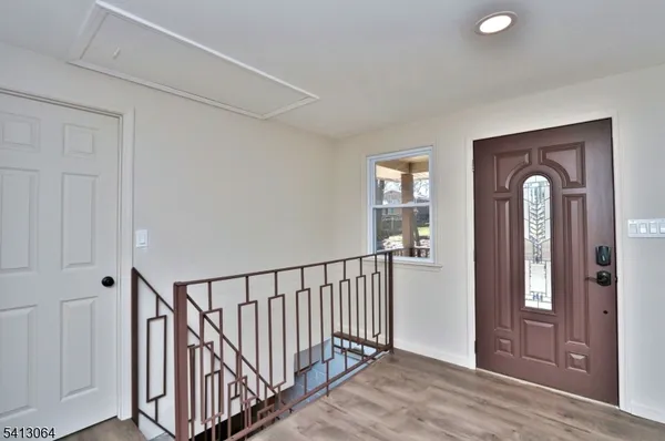 a view of entryway with wooden floor