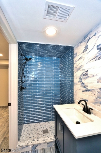 75 Nolans Point Road Lake Hopatcong, NJ 07849 - Photo 32 of 48 a bathroom with a sink a toilet and shower