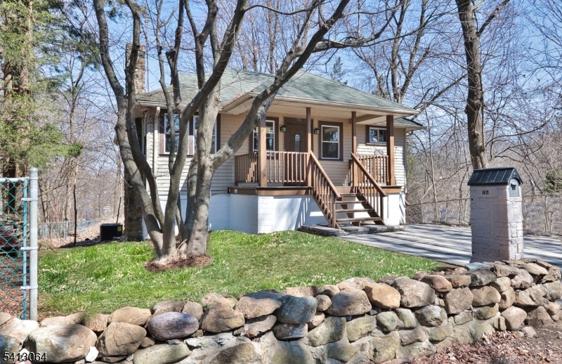 75 Nolans Point Road Lake Hopatcong, NJ 07849 - Photo 40 of 48 a view of a house with backyard and a tree