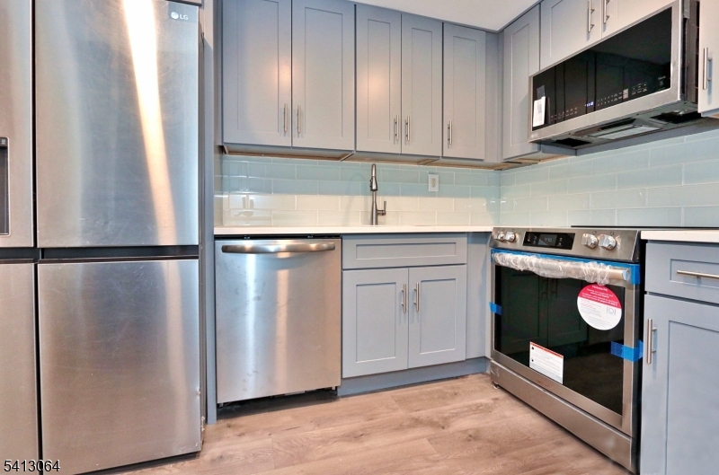 75 Nolans Point Road Lake Hopatcong, NJ 07849 - Photo 8 of 48 a kitchen with a refrigerator and a stove top oven