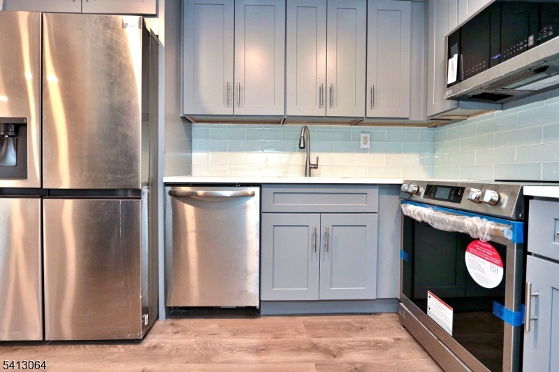 75 Nolans Point Road Lake Hopatcong, NJ 07849 - Photo 9 of 48 a kitchen with stainless steel appliances granite countertop a refrigerator a stove and a sink with granite countertops