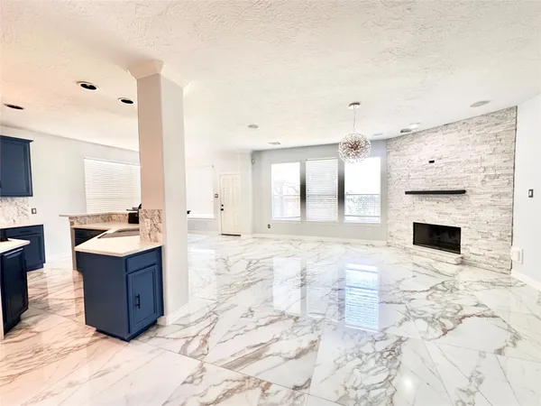 a view of living room with granite countertop furniture and fireplace