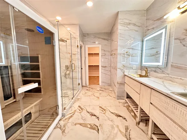 a large bathroom with a tub and a sink
