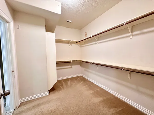 a view of a room with racks on the wall