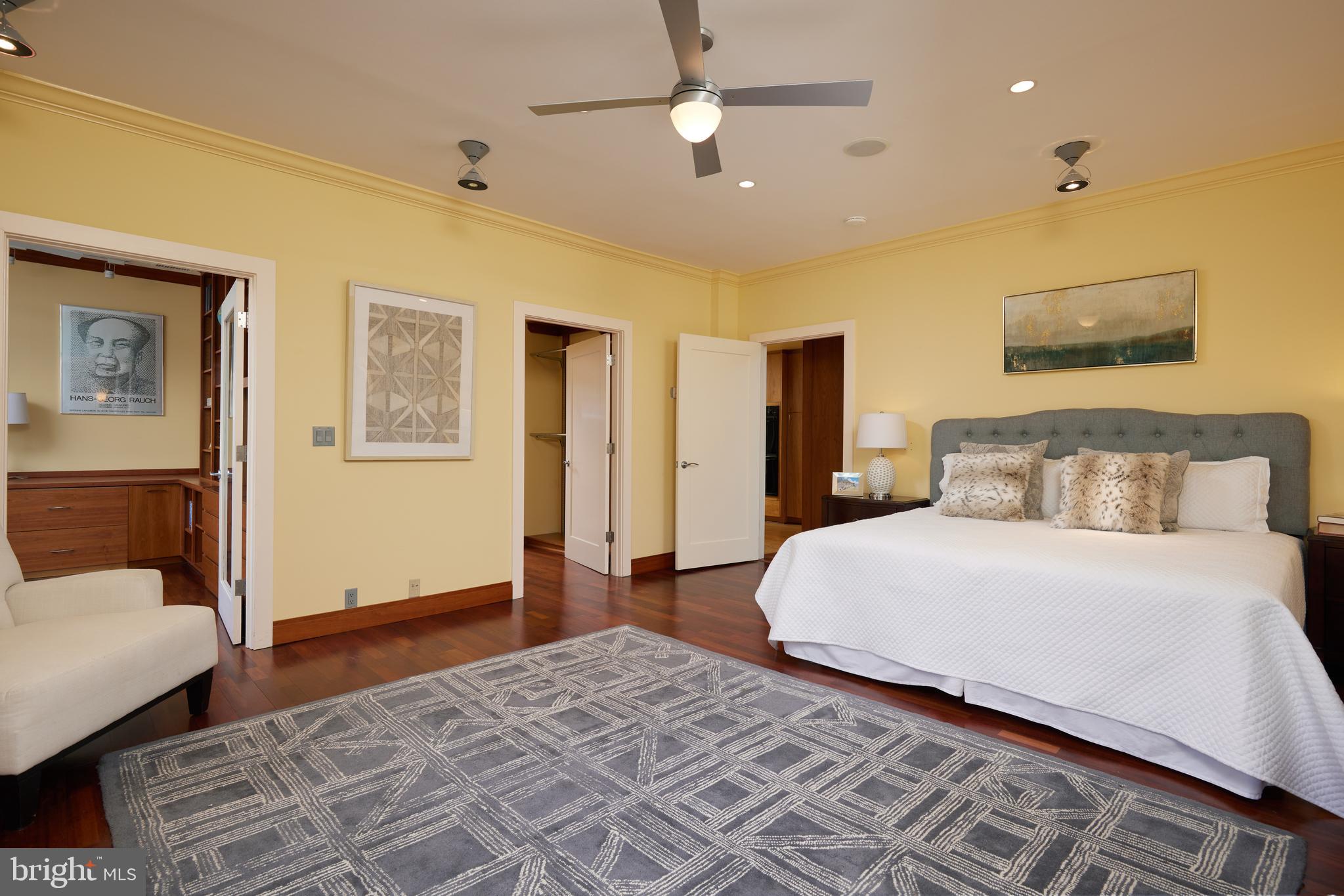2230 California Street Northwest, Unit 6AE Washington, DC 20008 - Photo 14 of 45 a bedroom with a large bed and wooden floor