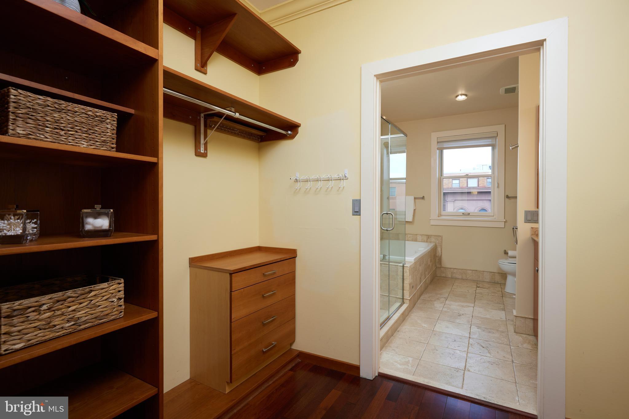 2230 California Street Northwest, Unit 6AE Washington, DC 20008 - Photo 15 of 45 a view of a hallway and wooden floor with a cabinet