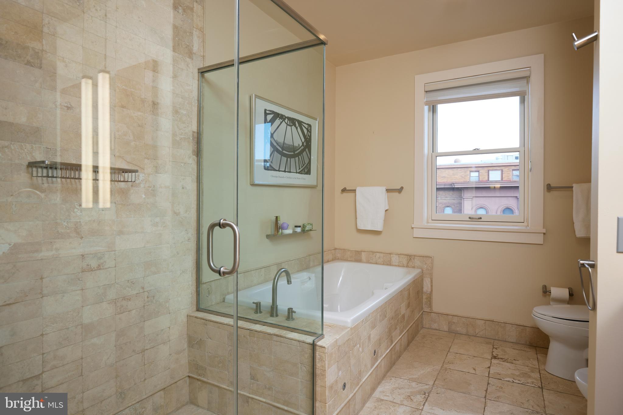 2230 California Street Northwest, Unit 6AE Washington, DC 20008 - Photo 17 of 45 a bathroom with a bathtub and shower