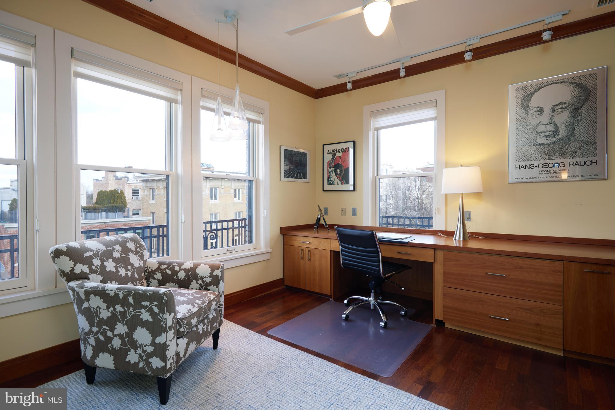 2230 California Street Northwest, Unit 6AE Washington, DC 20008 - Photo 18 of 45 a view of a workspace with furniture and a window