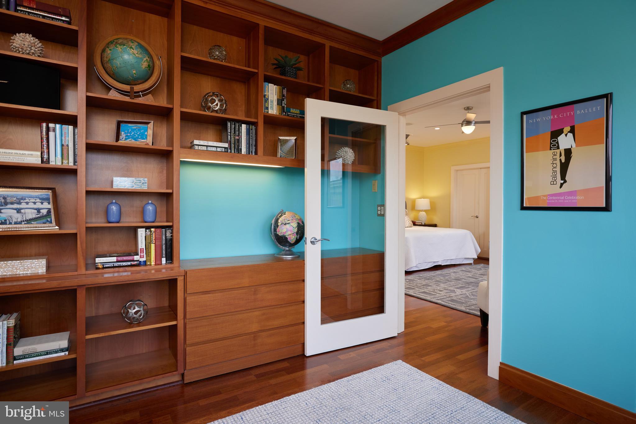 2230 California Street Northwest, Unit 6AE Washington, DC 20008 - Photo 19 of 45 a view of a bedroom with cabinets and book shelf
