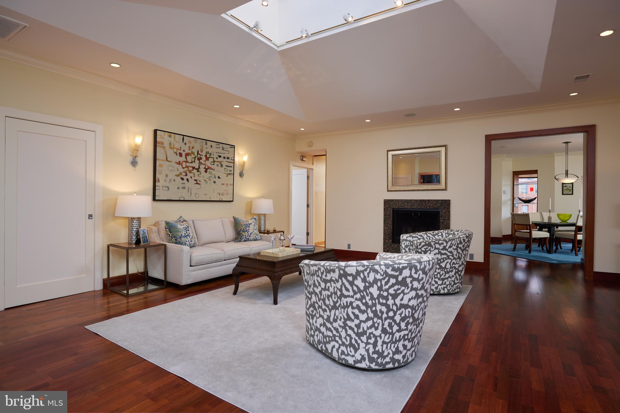 2230 California Street Northwest, Unit 6AE Washington, DC 20008 - Photo 2 of 45 a living room with furniture and a couch
