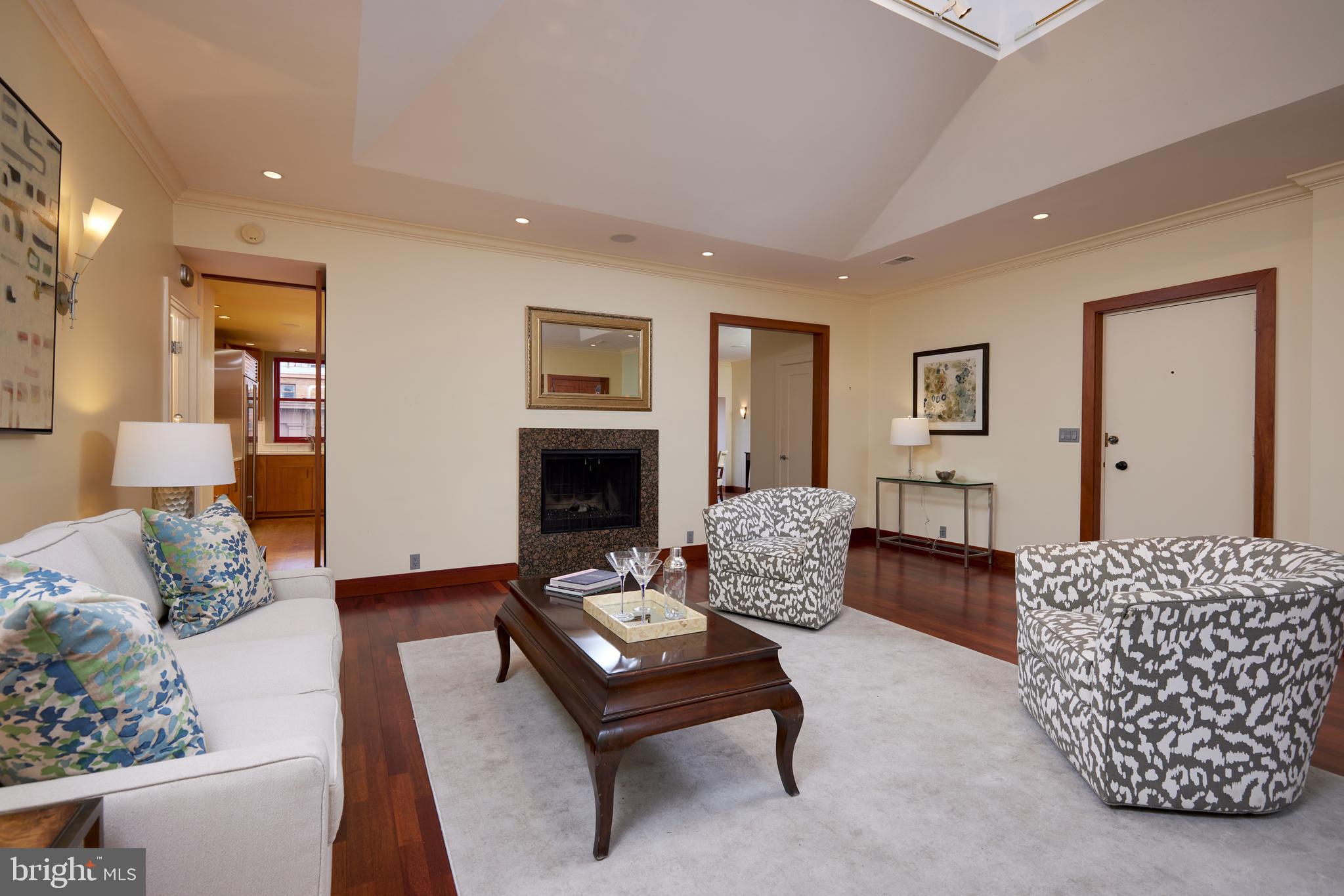 2230 California Street Northwest, Unit 6AE Washington, DC 20008 - Photo 3 of 45 a living room with furniture and a fireplace
