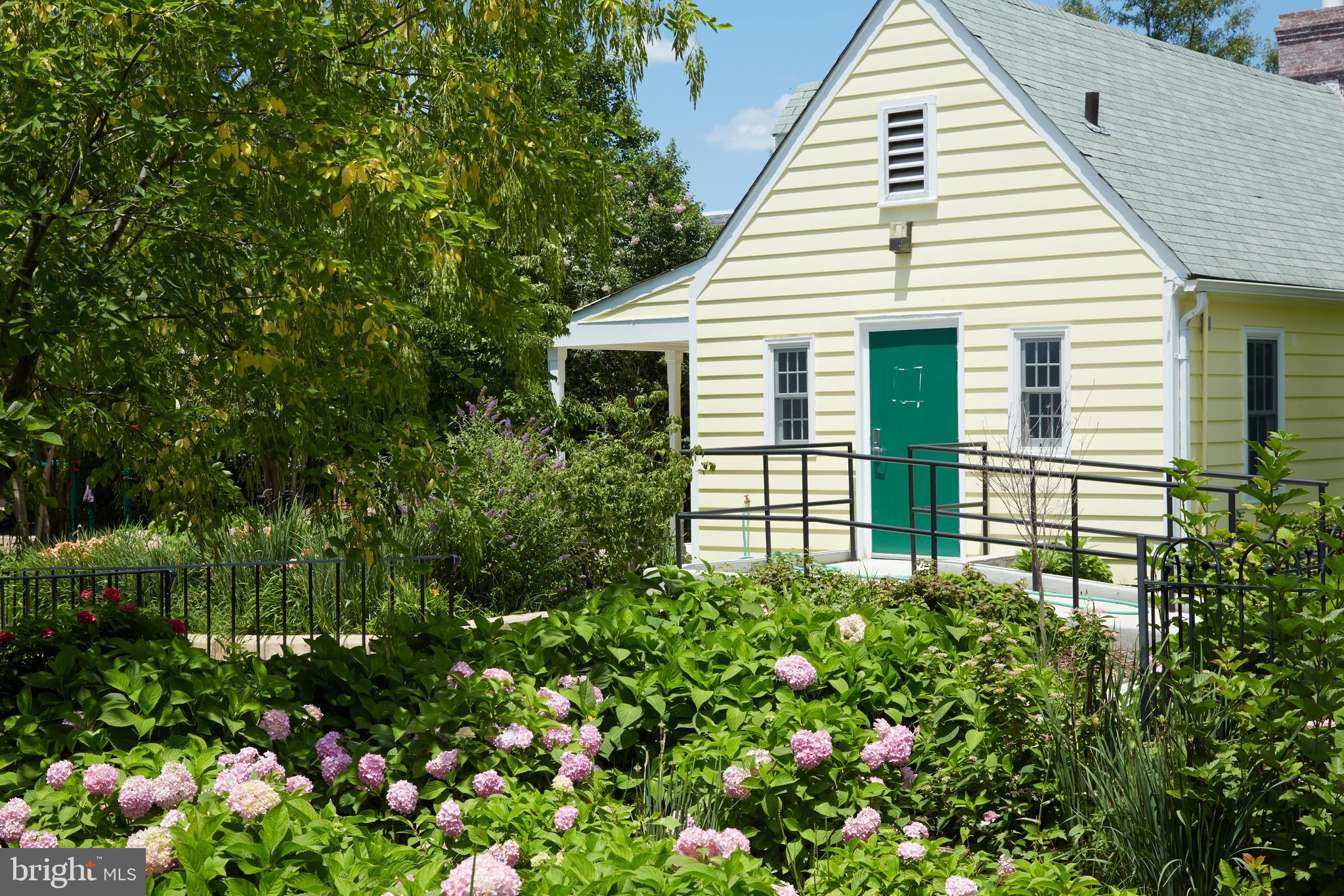 2230 California Street Northwest, Unit 6AE Washington, DC 20008 - Photo 42 of 45 a view of a house with a flower garden