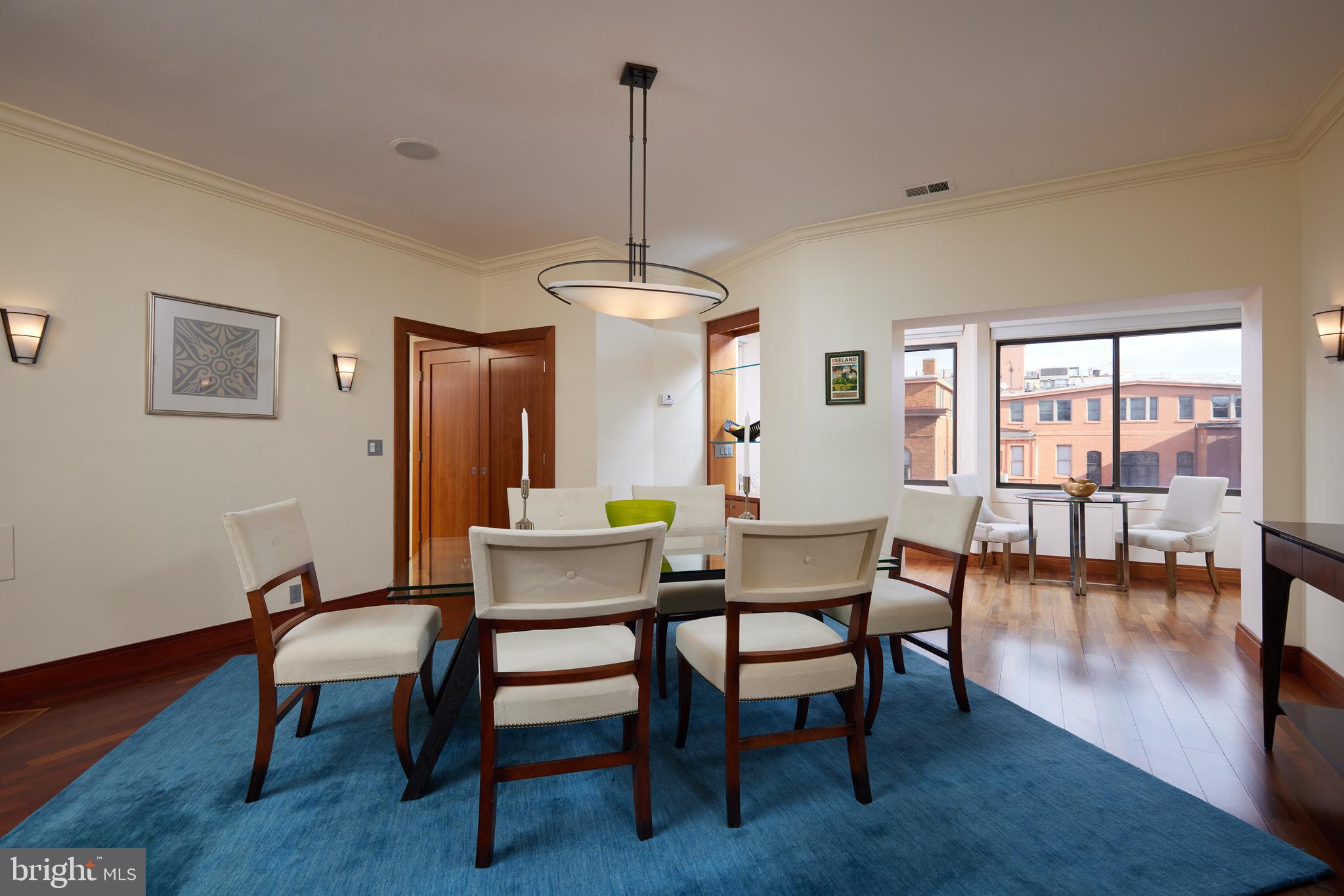2230 California Street Northwest, Unit 6AE Washington, DC 20008 - Photo 6 of 45 a view of a dining room with furniture window and wooden floor