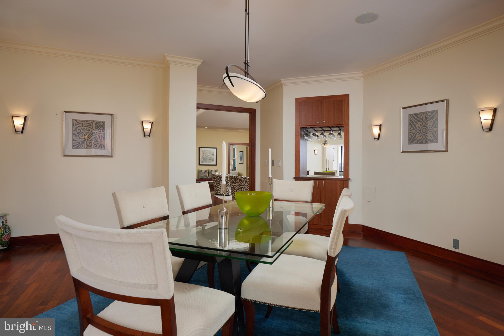 2230 California Street Northwest, Unit 6AE Washington, DC 20008 - Photo 7 of 45 a dining room with furniture and wooden floor