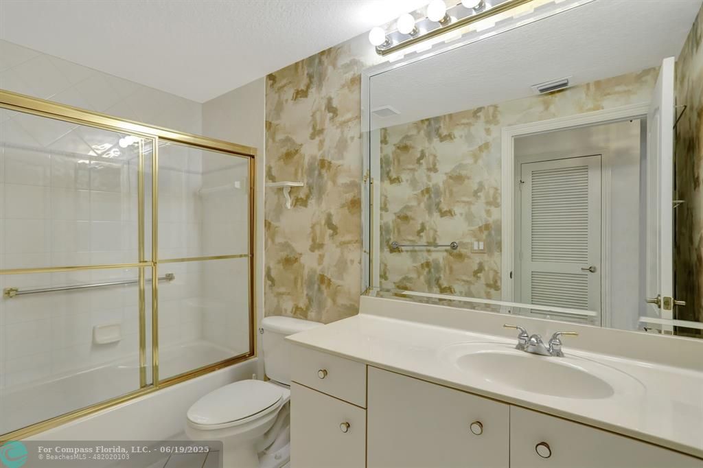 7727 Southampton Terrace, Unit 205 Tamarac, FL 33321 - Photo 12 of 36 a bathroom with a sink a toilet and shower