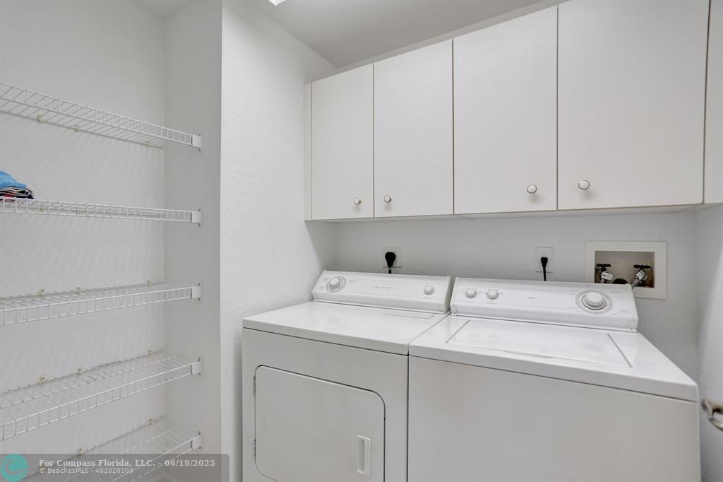 7727 Southampton Terrace, Unit 205 Tamarac, FL 33321 - Photo 14 of 36 a view of storage and utility room with washer and dryer