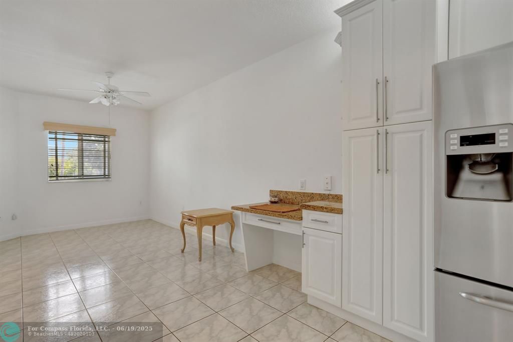 7727 Southampton Terrace, Unit 205 Tamarac, FL 33321 - Photo 18 of 36 a room with furniture a washer and dryer