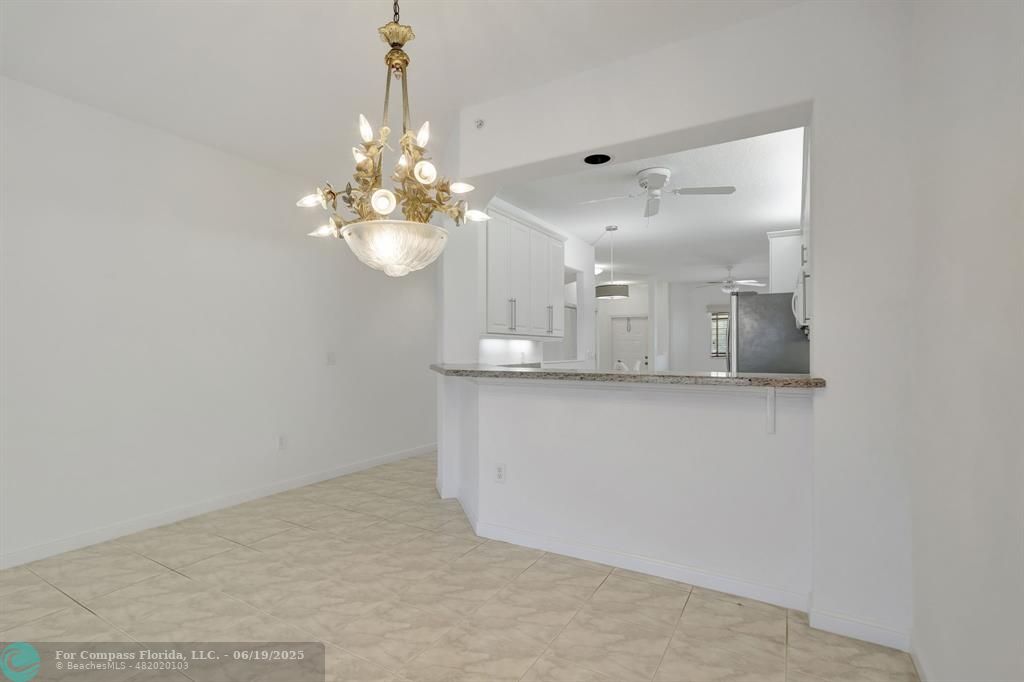 7727 Southampton Terrace, Unit 205 Tamarac, FL 33321 - Photo 20 of 36 a view of a chandelier in a room