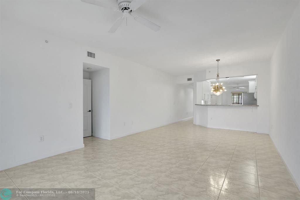 7727 Southampton Terrace, Unit 205 Tamarac, FL 33321 - Photo 24 of 36 an empty room with cabinet and mirrors
