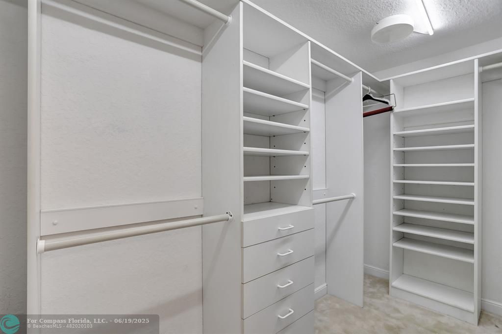 7727 Southampton Terrace, Unit 205 Tamarac, FL 33321 - Photo 25 of 36 a view of walk in closet with empty racks