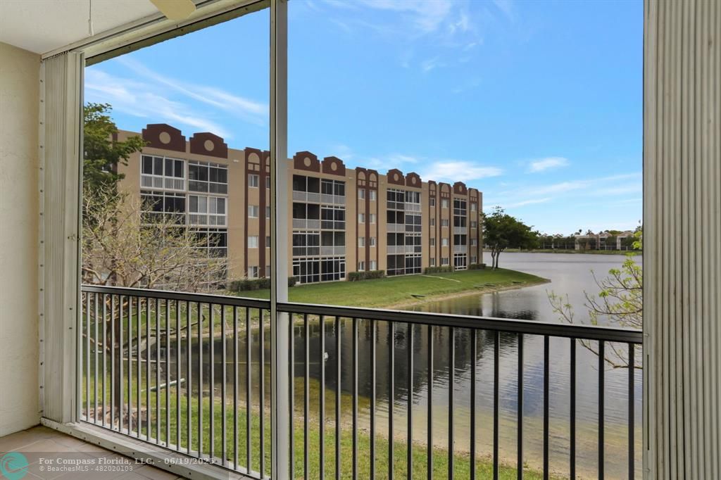 7727 Southampton Terrace, Unit 205 Tamarac, FL 33321 - Photo 28 of 36 a view of a balcony with lake view