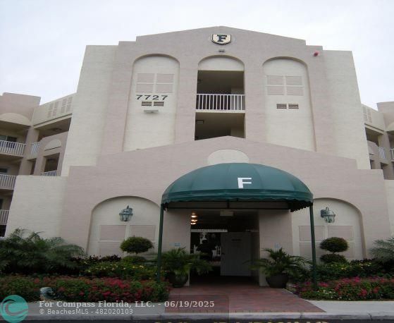 7727 Southampton Terrace, Unit 205 Tamarac, FL 33321 - Photo 8 of 36 a front view of a house with garden