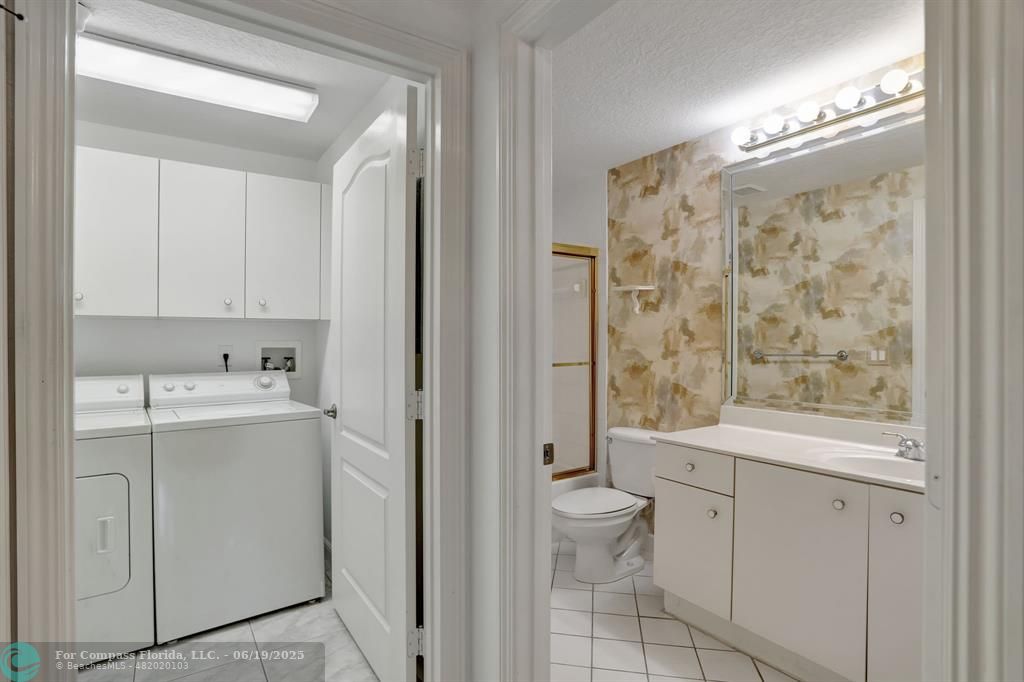 7727 Southampton Terrace, Unit 205 Tamarac, FL 33321 - Photo 9 of 36 a bathroom with a sink a toilet and shower