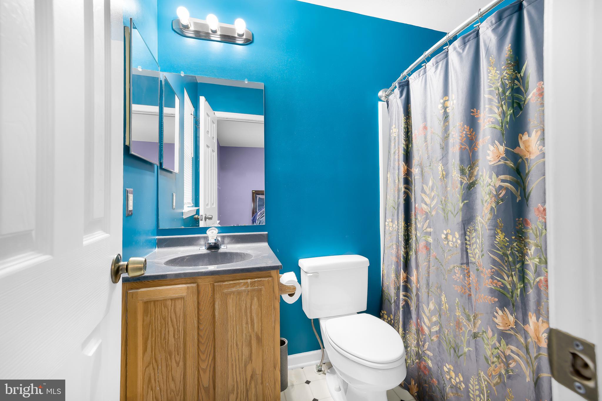 286 Vincent Circle Middletown, DE 19709 - Photo 20 of 29 a bathroom with a toilet sink and mirror