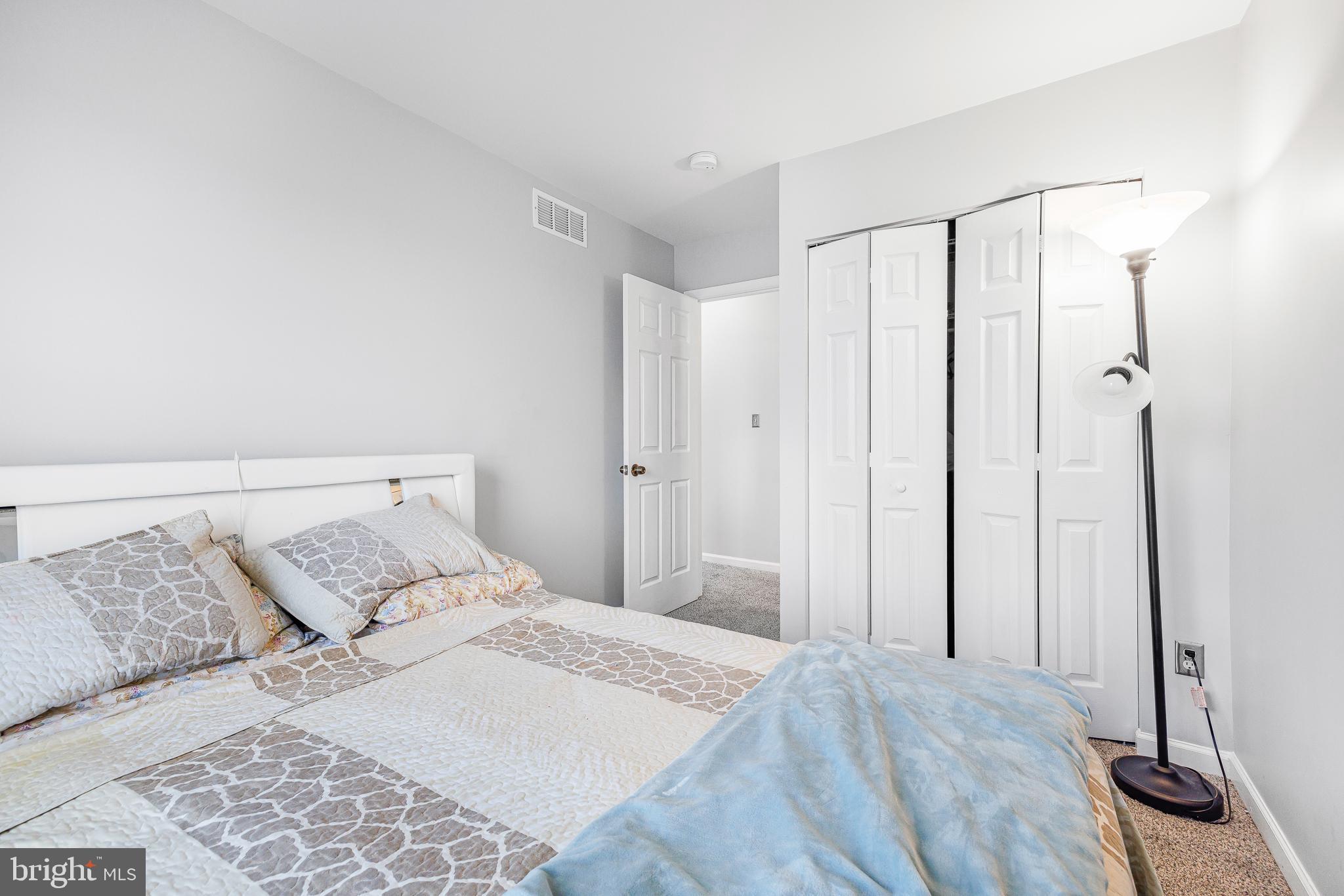 286 Vincent Circle Middletown, DE 19709 - Photo 22 of 29 a bedroom with a bed and a mirror