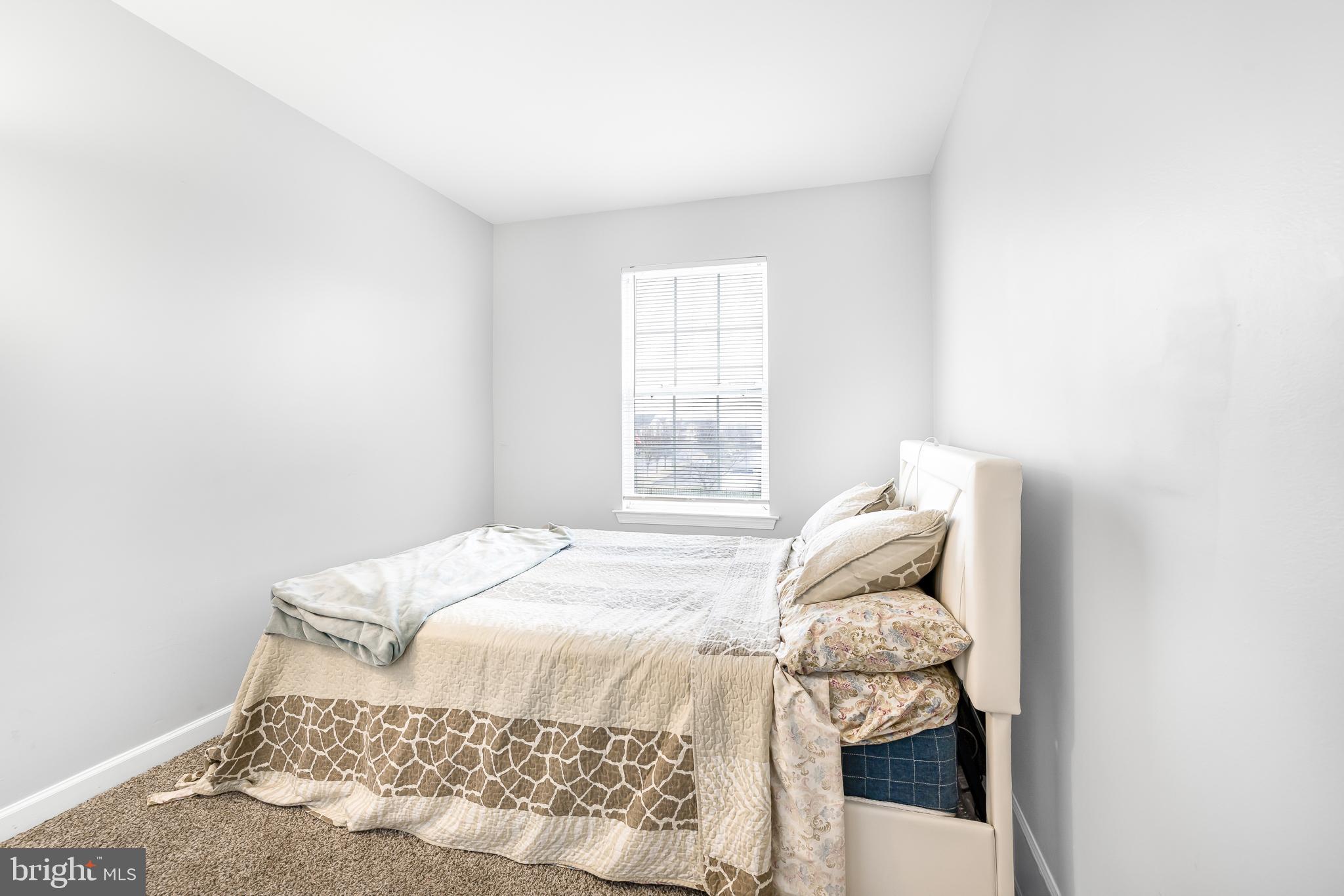 286 Vincent Circle Middletown, DE 19709 - Photo 23 of 29 a bedroom with a bed and a window
