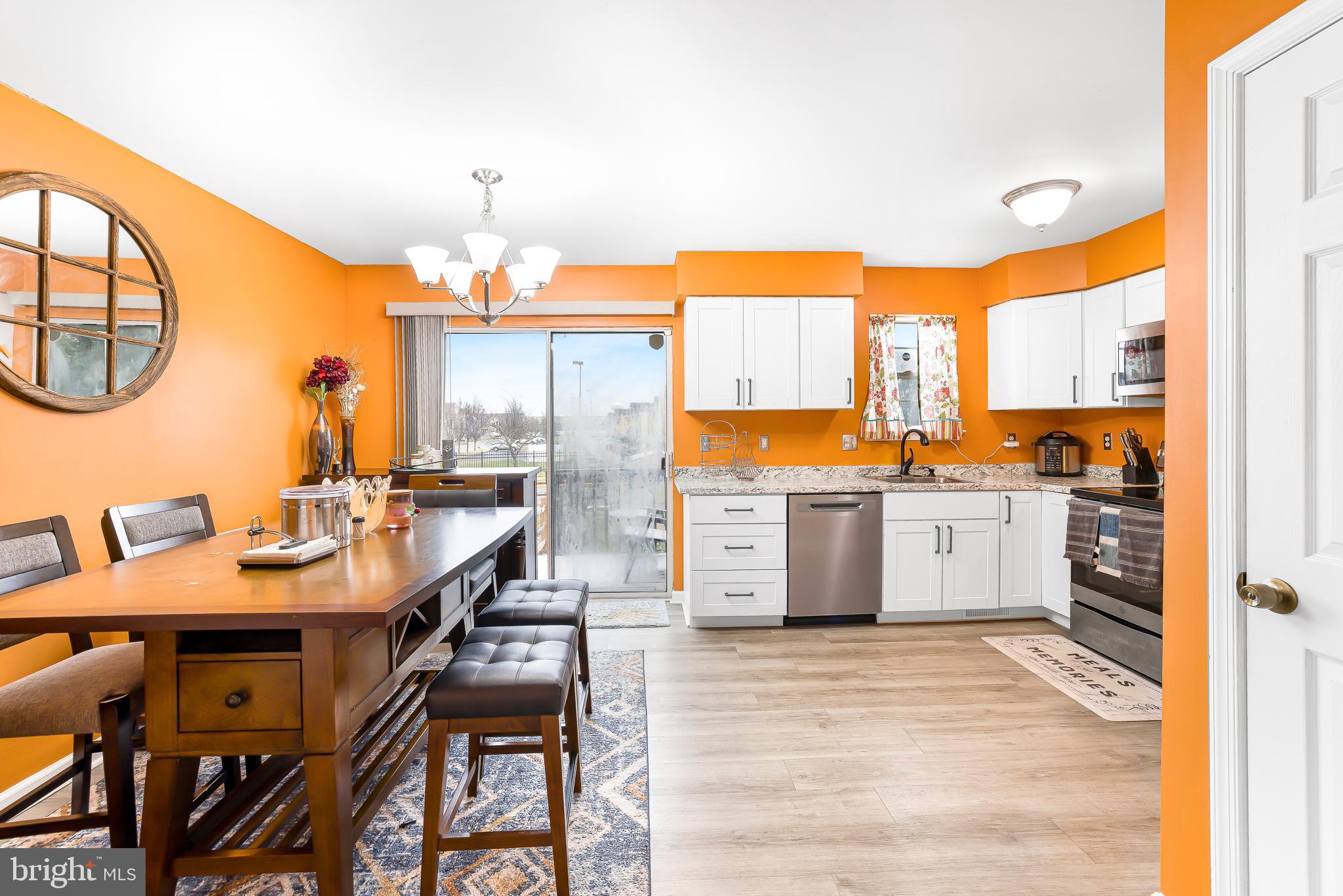 286 Vincent Circle Middletown, DE 19709 - Photo 10 of 29 an open kitchen with a table and chairs