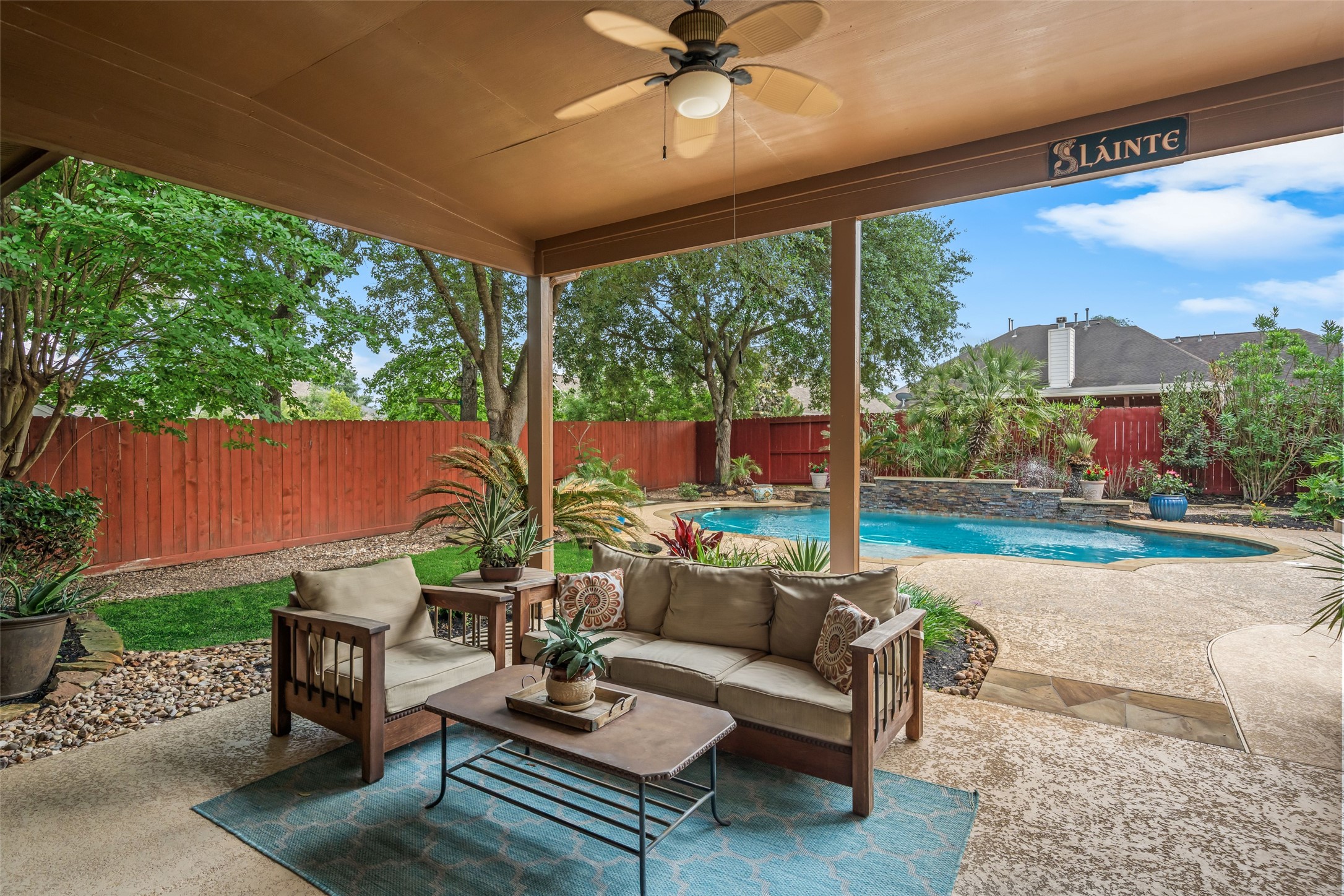 6407 Ashley Manor Drive Spring, TX 77389 - Photo 32 of 41 a outdoor living space with furniture and garden view