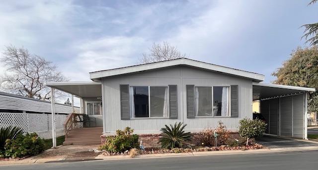 2706 West Ashlan Avenue, Unit 329 Fresno, CA 93705 - Photo 23 of 43 a house with a outdoor space
