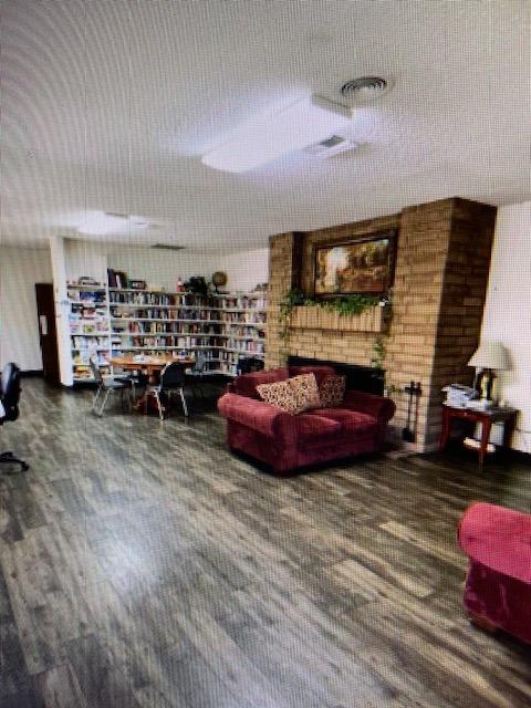 2706 West Ashlan Avenue, Unit 329 Fresno, CA 93705 - Photo 29 of 43 a living room with furniture and a fireplace