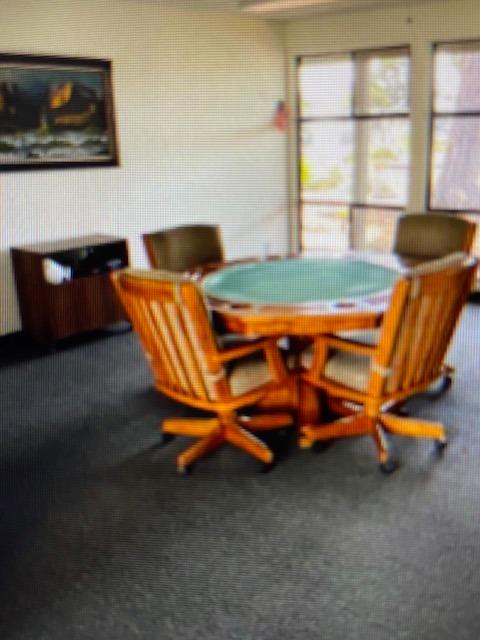 2706 West Ashlan Avenue, Unit 329 Fresno, CA 93705 - Photo 32 of 43 a backyard of a house with table and chairs