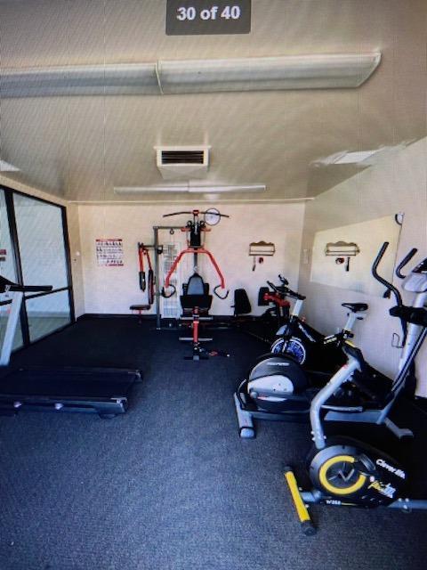 2706 West Ashlan Avenue, Unit 329 Fresno, CA 93705 - Photo 36 of 43 a living room with gym equipment