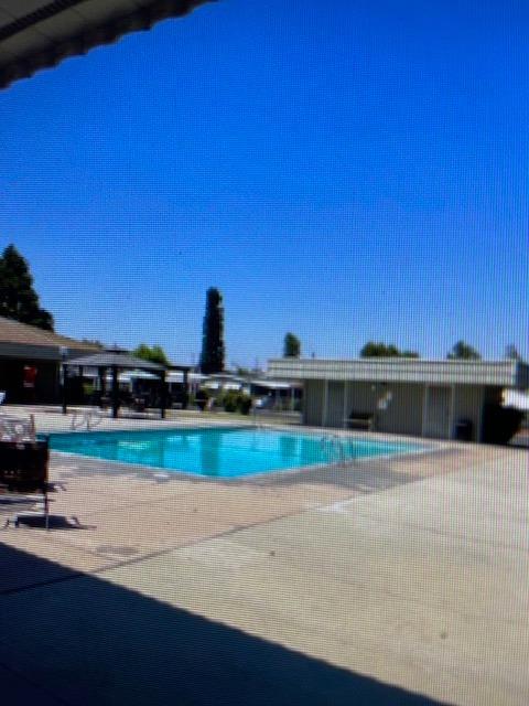 2706 West Ashlan Avenue, Unit 329 Fresno, CA 93705 - Photo 37 of 43 a view of houses with outdoor space