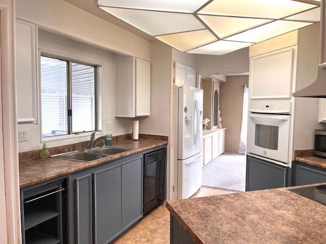 2706 West Ashlan Avenue, Unit 329 Fresno, CA 93705 - Photo 9 of 43 a kitchen with stainless steel appliances granite countertop a sink stove and refrigerator