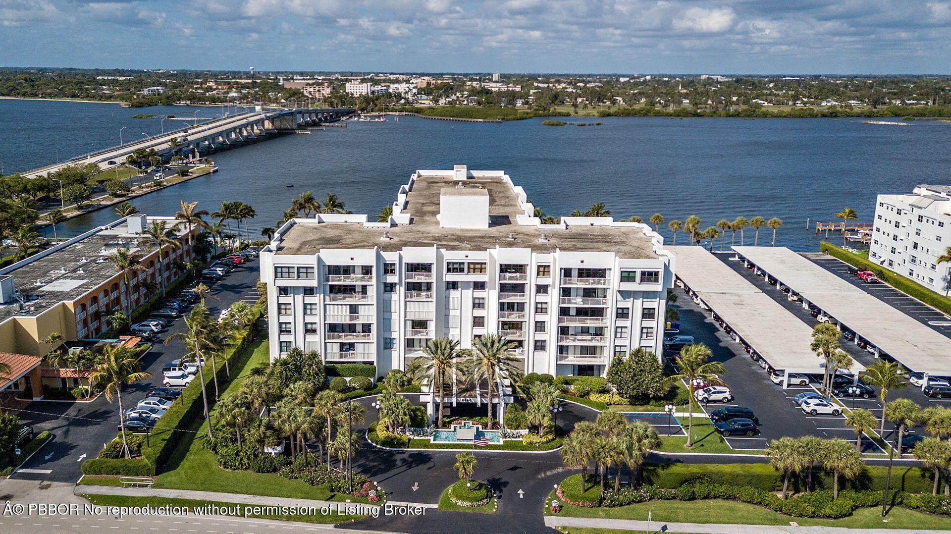 an aerial view of a house with a lake view