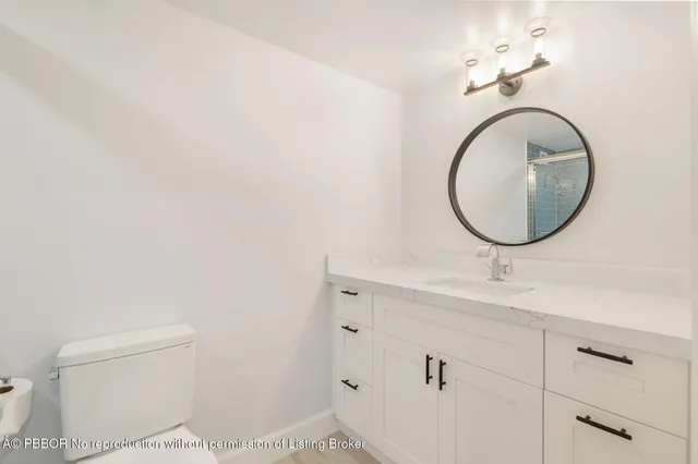 a bathroom with a shower and a sink