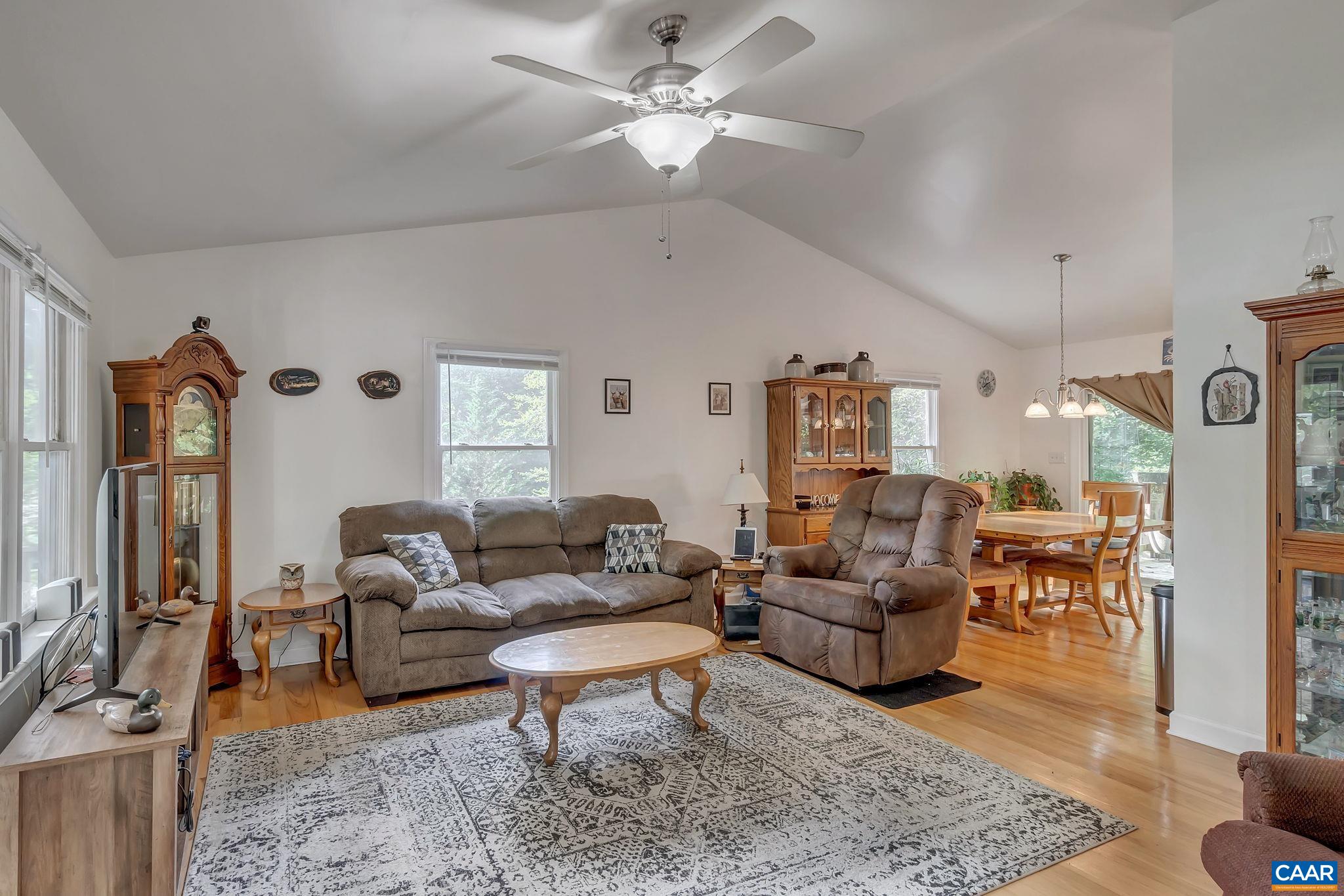 36 East Point Road Palmyra, VA 22963 - Photo 8 of 33 a living room with furniture ceiling fan and a rug