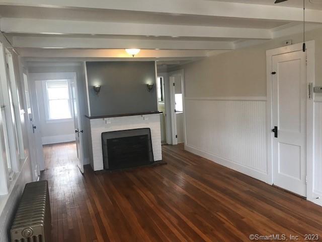 19 Greenfield Avenue Ridgefield, CT 06877 - Photo 3 of 28 a view of a livingroom with wooden floor and a fireplace